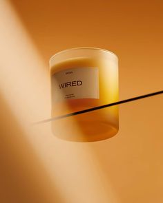 a candle with a label that reads wired