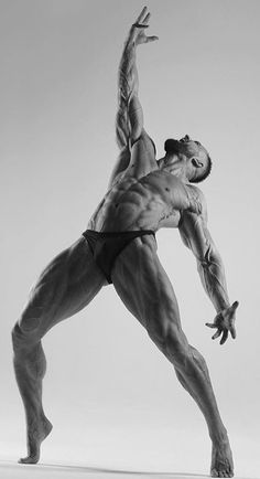 a man standing in the middle of a dance pose