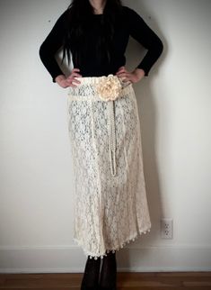 "This glamorous floor length skirt is simply stunning. Refashioned from a 1990s formal, it features a unique circle and dot wedding lace edging at the hem. A removable matching ecru peony flower with pearl center and long loops of faux pearls give this garment a real flapper vibe. Elastic waist. Size: L Waist: 30\" Hips: 41\" Length 41\" Note: because this is repurposed from a vintage gown, be aware there could be some imperfections in the garment. Note: Please take your measurements and use them as a guide for sizing." Vintage Skirt For Spring Wedding, Elegant Spring Maxi Skirt With Lace Trim, Spring Wedding Lace Maxi Skirt, Bohemian Fitted Maxi Skirt For Wedding, Fitted Full-length Maxi Skirt For Wedding, Fitted Bohemian Maxi Skirt For Wedding, Fitted Beige Skirt For Wedding, Beige Fitted Skirt For Wedding, Spring Wedding Lace Skirt