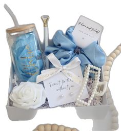 a blue and white gift box filled with items