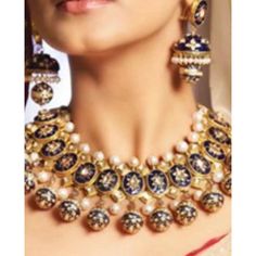 The set includes a necklace and a pair of matching jhumkey earrings with pearl saharay. Customization: The hanging balls will be right under the oval piece and a single pearl instead of pearl bunch right under the diamond shaped kundan piece. The earrings will be same as pictured. Gold-plated on high-quality brass as base metal. Made by order. Kindly allow 6-7 weeks for the delivery of this item. For custom or urgent requests, please contact support@alacouture.com. *Please Note: We use faux stones and beads in all of our jewelry. Fusion Kundan Jewelry With Pearl Drop, Elegant Heavy Jewelry Sets For Navratri, Festive Pearl Drop Jewelry Sets, Fusion Style Pearl Drop Jewelry For Festivals, Bollywood Style Jewelry Sets With Pearl Drop For Festivals, Bollywood Style Pearl Drop Jewelry Sets For Festivals, Fusion Pearl Drop Jewelry For Diwali, Fusion Style Pearl Drop Jewelry For Diwali, Single Pearl