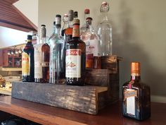 several bottles of liquor are sitting on a shelf