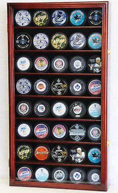 a display case filled with lots of different types of pucks