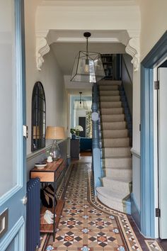 the hallway is decorated in blue and beige