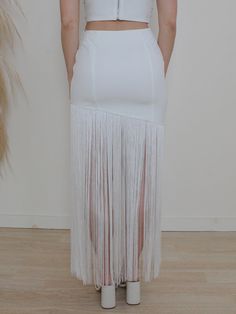 The So Gatsby will transport you to one of your best nights when you strut around in this fringe detailed skirt. This smooth and fitted mini skirt is chic on top with fringe water-falling from the hem line so you can make a statement where ever you go! THE FIT: Fits true to size Hidden side zip & hook closure Lined WAIST LENGTH OF MINI SKIRT LENGTH W/ FRINGE S 26" 15" 37.25" M 28" 15.5" 38" L 30" 16.5" 38.5" MATERIAL/CARE: 100% Polyester Hand wash. Lay flat to dry