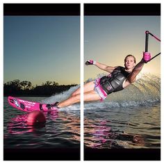 a woman riding on top of a pink surfboard in the ocean while being pulled by a boat