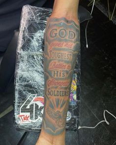 a man with a tattoo on his arm that says god toughest battles his opponent soldier