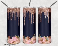 two blue and pink tumbles with rose designs on them, one has gold glitter