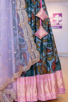 Stand out in this beautiful Grey and Light Pink Kanchi Pen Kalamkari Lehenga! This gorgeous ensemble will be the perfect addition to any wardrobe with its intricate and eye-catching design. The lehenga is made of premium quality fabric and features a unique kalamkari pattern that will turn heads. Make a statement with this luxurious and unique piece! Pen Kalamkari Lehangas, Kalamkari Lehenga, Kalamkari Pattern, Kalamkari Dupatta, Pink Pen, Pink Pens, Kids Wear Girls, Block Print Saree, Fancy Gowns