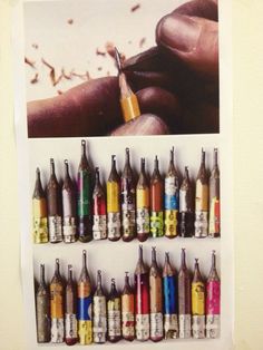 there are many different colored bottles on the wall and one has a pen in it