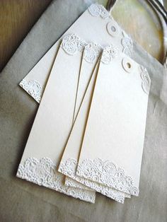 some white cards with lace on them