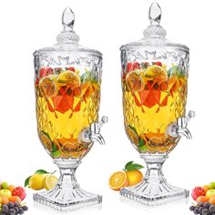 two glass goblets filled with liquid and fruit