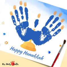 a happy hanukkah card with a hand print