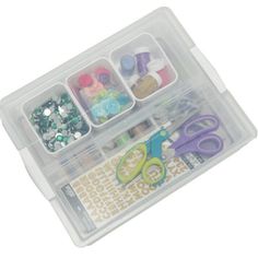 a plastic container filled with lots of crafting supplies