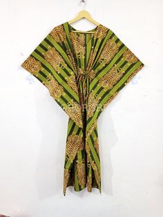 "BohoRobes Animal Printed Cotton Kaftan Dress, Cotton Summer Dress, Boho Maxi Dress, Beach Cover Up, Gifts For Her Size - Free Size Length - 44/ 48/ 52 Inches Bust/chest size - 120 CM/ 48 Inches Fabric - 100% Cotton Pattern - Tiger Print Green Tiger Print Kaftan Dress, Indian Kaftan, Cotton Caftan Dress, Long Dress, Beach Dress, Kaftan For Women, Boho Maxi Dress Kaftan has Adjustable Drawstring Waist to loose or tight , Kaftan has V Shape Neck Which is 8\" Inches Deep. Kaftan Is Multi-purpose an Green Bohemian Beach Dress With Short Sleeves, Green V-neck Tunic For Beach, Yellow Summer Kaftan For Beach Season, Green V-neck Kaftan For Vacation, Bohemian Green Kaftan With Kimono Sleeves, Bohemian Tunic Kaftan For Holiday, Yellow Summer Kaftan For Festivals, Summer Tunic Kaftan For Home, Traditional Summer Kimono For Vacation