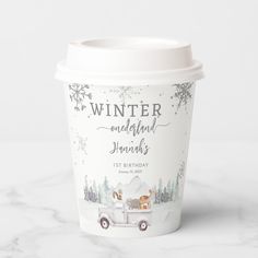 a paper cup with the words winter wonderland on it and an image of a horse drawn carriage