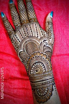 a henna tattoo on the palm of someone's hand