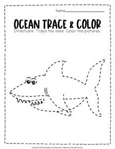 an ocean trace and color book with a shark in the water, which is cut out into