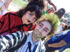 two people are taking a selfie at an outdoor event