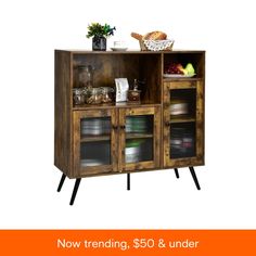 a wooden cabinet with glass doors and shelves filled with food on top of it, the words now trending $ 50 & under