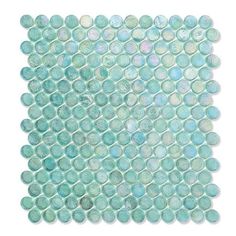 a square tile with blue and green circles on the bottom, in shades of aqua