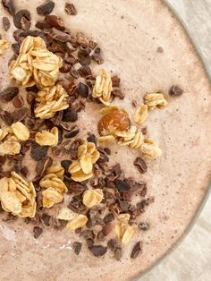 a glass bowl filled with oatmeal and chocolate chips