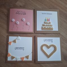 four greeting cards with different designs on them