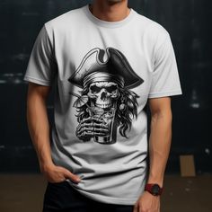 Ahoy, Mateys! Set sail on the high seas of style with our unique Pirate Skull Cocktail T-Shirt! This eye-catching tee features a bold illustration of a skull pirate enjoying a tropical drink, blending edgy and fun elements perfectly. Perfect For: - Pirate-themed parties - Beach vacations - Casual outings - Gifts for friends who love unique and quirky designs These tees are made with responsibly sourced organic cotton that's grown with no hazardous chemicals; a green choice that's bound to speak Themed Crew Neck Shirt With Sublimation Print, Graphic Tee Shirt With Skull Print And Crew Neck, Themed Crew Neck Top With Screen Print, Themed Crew Neck Shirt Pre-shrunk, Themed Crew Neck Shirt With Pre-shrunk Details, Themed White Crew Neck Top, Themed Pre-shrunk Crew Neck Shirt, Halloween T-shirt With Skull Front Print, Pirate Drinks