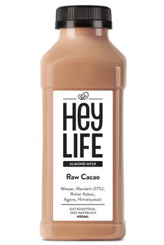 a bottle of raw cacaco sauce on a white background with the words hey life above it