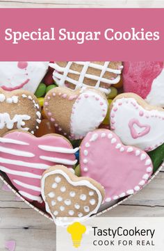 a heart shaped box filled with cookies on top of a white wooden table and text overlay that reads, special sugar cookies