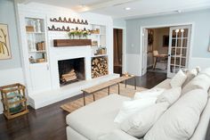 a living room filled with furniture and a fire place