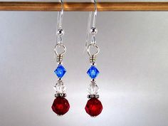 "These patriotic earrings which I call Patriot are made with siam (red), sapphire (blue) and clear (white) top quality name brand crystals, bali silver and sterling silver. They dangle from sturdy sterling silver french hook earwires and measure 1.5\" from the top curve of the earwire to the bottom of the faceted round crystal. What a great way to show your love of country or of all things nautical and still satisfy your love of bling! Please feel free to ask me any questions you may have about Patriotic Silver Dangle Earrings, Silver Dangle Patriotic Earrings, Silver Jewelry For 4th Of July Gift, Silver Jewelry Gift For 4th Of July, Patriotic Blue Dangle Jewelry, Patriotic Drop Earrings Jewelry Gift, Patriotic Dangle Jewelry For Gifts, Blue Ear Wire Jewelry For 4th Of July, Handmade Patriotic Silver Jewelry