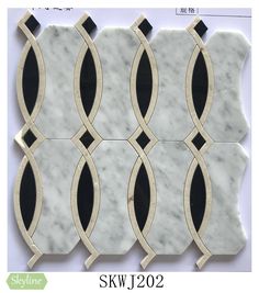 six white marble tiles with black and gold trimmings on each side, in different sizes