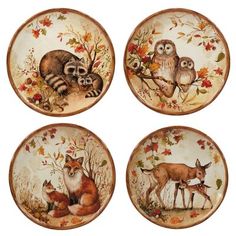 four plates with animals painted on them