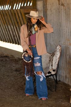 Discover the perfect blend of rugged style and comfort with our Sassy High Waisted Ripped Jeans, uniquely designed for the bold at heart. Embrace your inner cowgirl with this statement piece that's both daring and reliable. Please note, our model is wearing size 3 and we recommend sizing up for the ideal fit. Chic Country Outfits, Modern Western Outfits, Dressy Western Outfits Women, Black Western Outfit, Nfr Vegas, Nfr Outfits, Western Fits, High Waisted Ripped Jeans, Christmas Punch