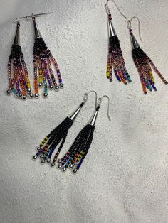 Native American Inspired Fringe Earrings with Feathers - My Community Made Multicolor Long Drop Fringe Earrings, Multicolor Beaded Tassel Earrings As Gift, Artisan Multicolor Beaded Tassel Earrings, Long Drop Beaded Tassel Earrings For Festival, Multicolor Tassel Earrings With Dangling Beads, Multicolor Long Drop Beaded Earrings With Fringe, Multicolor Long Drop Earrings With Beaded Fringe, Multicolor Fringe Beaded Earrings As Gift, Multicolor Beaded Fringe Earrings With Unique Style