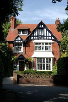 a large brick house with white trim and windows