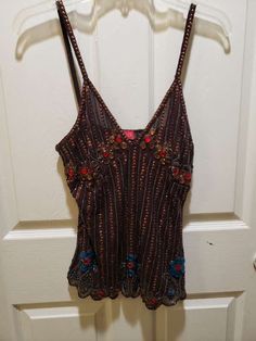 This corset strap beaded short blouse has beautiful brown beads with red beads. It is mark Aftershock size small, 100% silk. . The brown beaded blouse is a size small. It is used and has missing beads. Measurements are flat across breast 15 1/2 ", hip across flat 20". Height from top strand to bottom of blouse 24". It has a side zipper. Bead Top, Beaded Corset, Short Blouse, Style Bundle, Vintage Corset, Beaded Blouse, Red Beads, Beaded Top, Really Cute Outfits