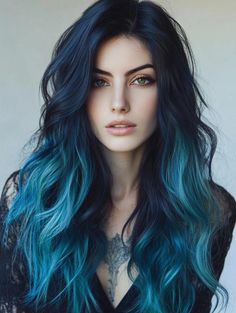 This ombre style exudes a mysterious, alluring vibe with its midnight black roots gradually blending into rich teal hues at the ends. The deep, dark base adds intensity, while the vibrant teal provides a striking contrast that feels both edgy and sophisticated. The loose, voluminous waves enhance the ombre effect, allowing the colors to flow... Black And Mint Hair, Dark Blue To Light Blue Hair Ombre, Winter Vivid Hair Color, Black To Blue Ombre Hair, Black And Purple Ombre Hair, Crazy Color Hair Ideas, Witchy Hair Color, Blue And Teal Hair, Long Colored Hair