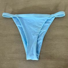 This Is A Pair Of Light Blue Ribbed High Cut Bikini Bottoms. - Small - High Cut - Swimsuit Lined - Never Worn But Tags Removed From A Smoke-Free, Pet-Free Home. Solid Swimwear With Boning For Summer, Stretch Swimwear With Boning For Beach, Blue Fitted Beachwear Swimwear, Solid Swimwear With Boning For Poolside, Swimwear With Boning For Poolside, Boned Beach Bottoms For Summer, Blue Triangle Top Swimwear With Lined Body, Fitted Blue Swimwear For Beach Season, Solid Color Tie-side Swimwear For Parties