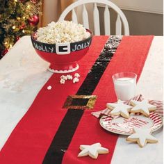 a bowl of popcorn and some cookies on a table