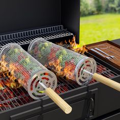 two bbq grills with burning vegetables on them and one is being used as a barbecue grate