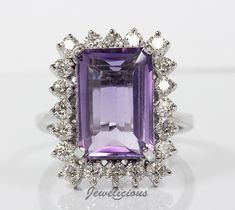 Stunning 8.44 TCW Natural Amethyst and Diamonds Halo Cluster Large Luxury Ring in 18K White Gold, Anniversary -Birthday Gift - Statement Jewelry. This item is in stock and can be shipped right away. Please, allow 1-2 business days for processing. Photos of an actual item you will receive! Only 1 in stock, UNIQUE AND RARE FIND! Ring size: 7.75 US size (free resizing on request, ask before purchase if can be resized to your size). Ring face dimensions: 16 x 20 mm, Metal type: white gold, Metal purity: 18K (tested), Total weight: 8.96 gr, Center stone: natural amethyst, emerald cut, purple color, Center stone weight: 7.44 ct., Side stones: natural diamonds, round cut, Diamonds weight: 1 ct. approx., Most diamonds color:  H, Most diamonds clarity: VS-SI. This item will be shipped in a nice jew Face Dimensions, Luxury Ring, Gold Anniversary, Luxury Rings, White Gold Engagement, Engagement Anniversary, Gold Engagement, Conflict Free Diamonds, Diamond Clarity