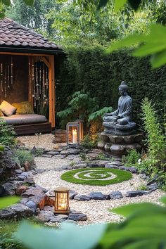 a buddha statue in the middle of a garden with rocks and stones around it, surrounded by greenery