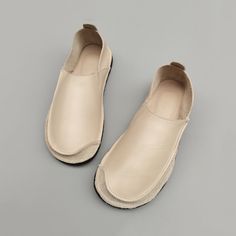 Beige Slip-on Flats With Flat Bottom, Beige Slip-on Flats, Leather Slip-ons With Leather Footbed, Elegant Everyday Slip-ons With Flat Heel, Flat Heel Leather Shoes With Textured Sole, Elegant Everyday Slip-ons With Leather Sole, Beige Flat Bottom Slip-ons, Beige Slip-ons With Textured Sole For Everyday, Beige Flat Slip-ons With Leather Sole