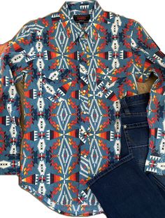 Multicolor Cotton Western Shirt, Multicolor Cotton Tops For Rodeo, Blue Western Style Tops For Fall, Blue Western Tops For Fall, Multicolor Casual Shirt For Rodeo, Western Style Long Sleeve Graphic Print Shirt, Western Style Long Sleeve Shirt With Graphic Print, Western Long Sleeve Shirt With Graphic Print, Western Style Blue Relaxed Fit Tops