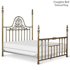 a metal bed frame with an intricate headboard and foot board, made in gold