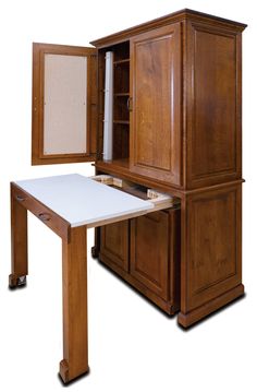 a wooden desk with an open cabinet on it's side and a white board in the middle