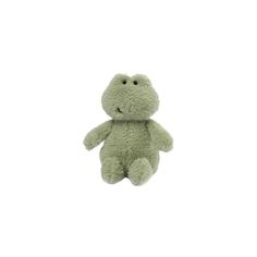 a green stuffed animal sitting up against a white background