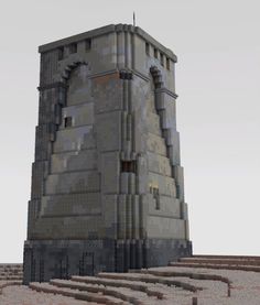 a very tall building sitting in the middle of a desert area with lots of dirt